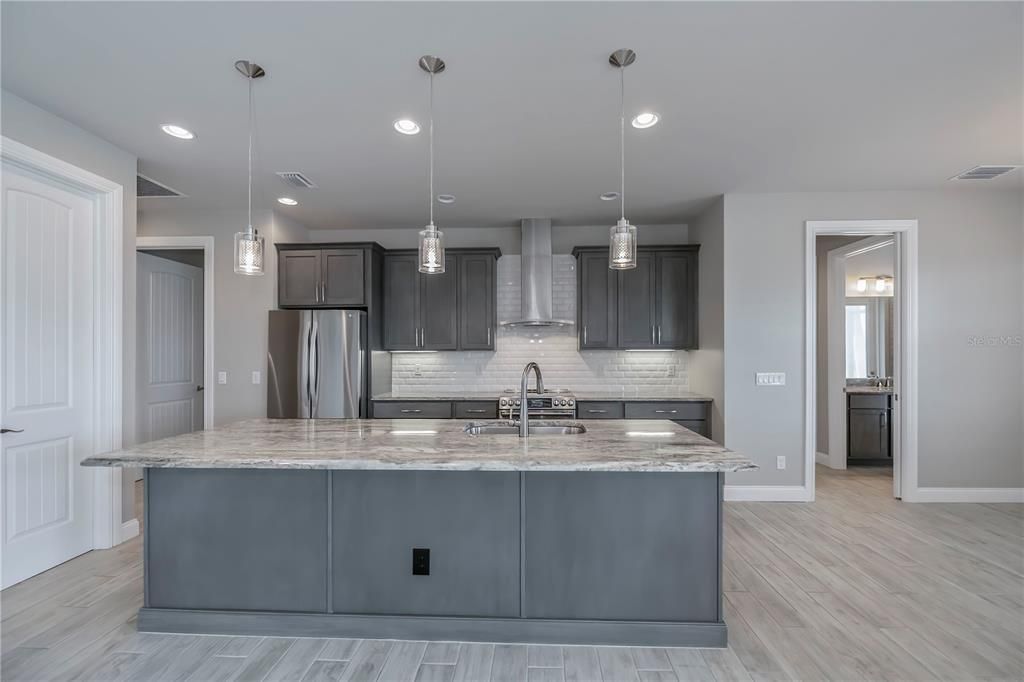 The subway tiled backsplash give this kitchen a true coastal vibe!