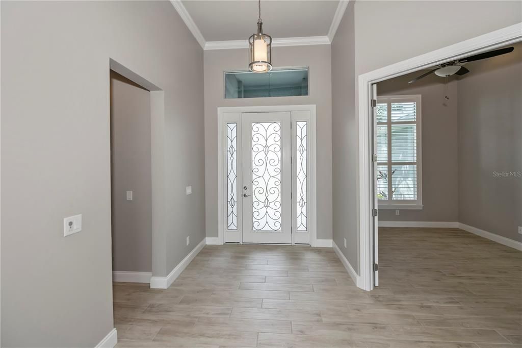 Front foyer! Master suite to the left in this photo and bonus room/office to the right of the front door.