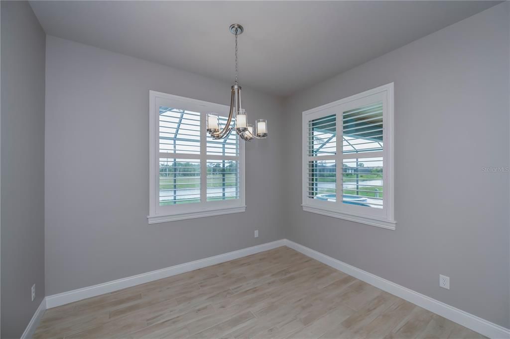 Dining room overlooking the pool and the serene waterway