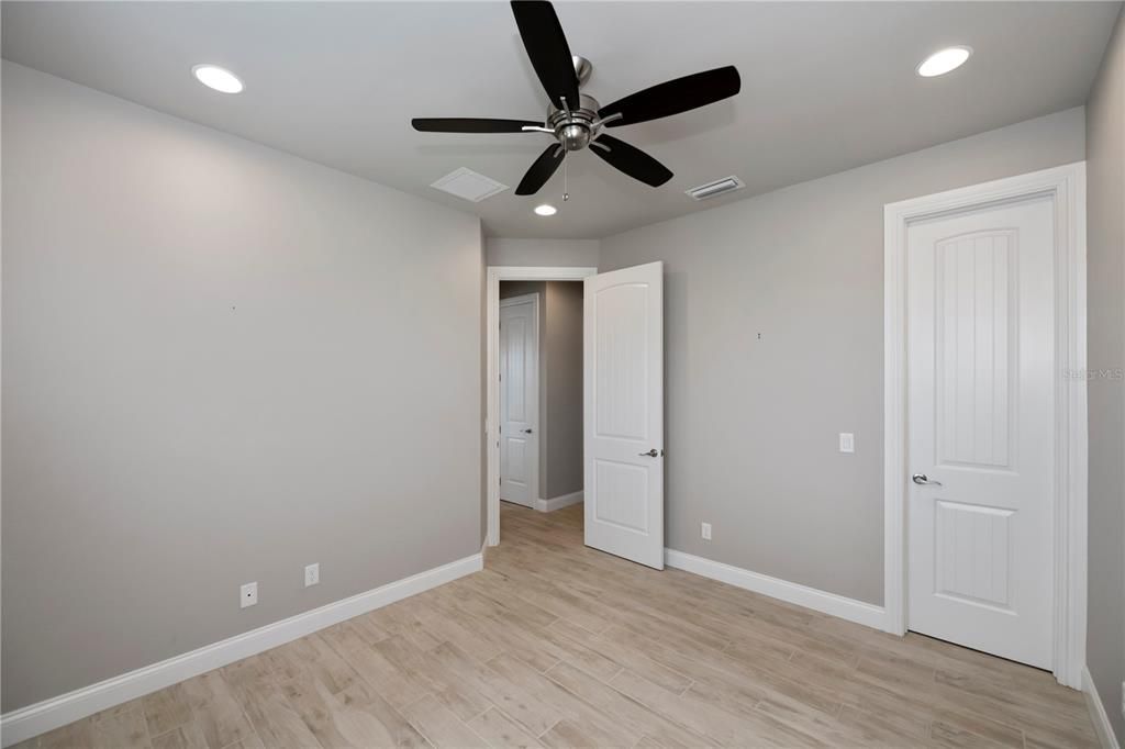 Guest bedroom 1 with walk-in closet