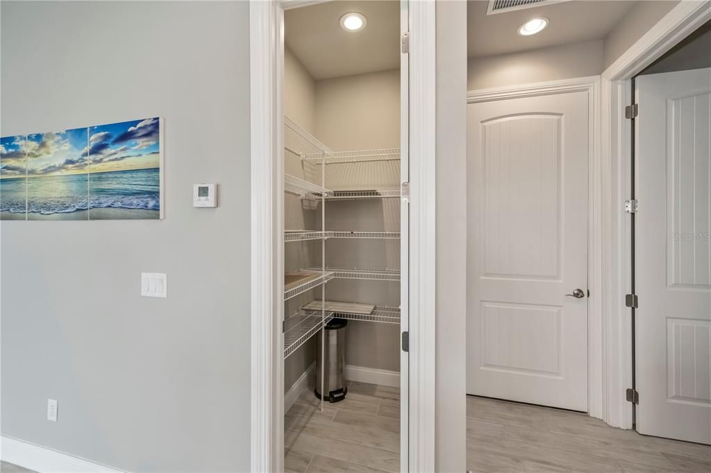 Walk-in closet pantry! The garage door is just to the right of the pantry. The laundry room is the door that is open to the right of the garage.