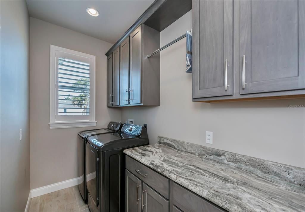 Massive laundry room with ample storage space!