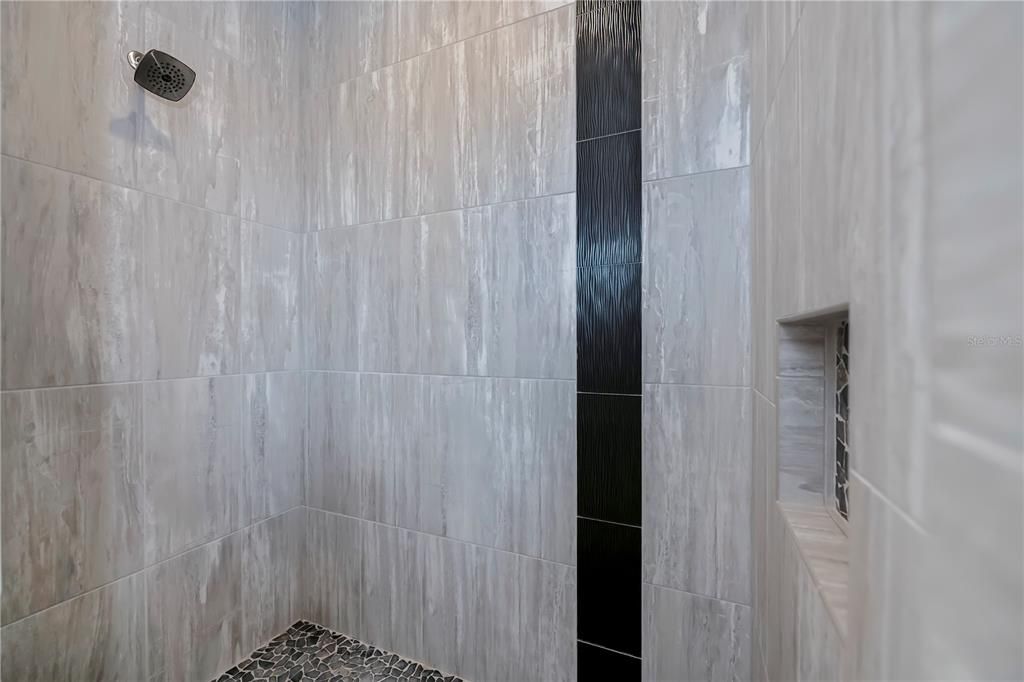 Walk-in shower with built in shelf