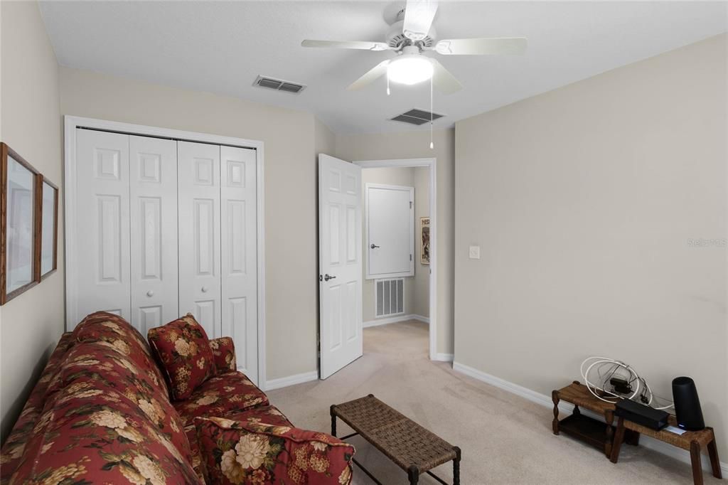 Guest bedroom features wall to wall carpeting