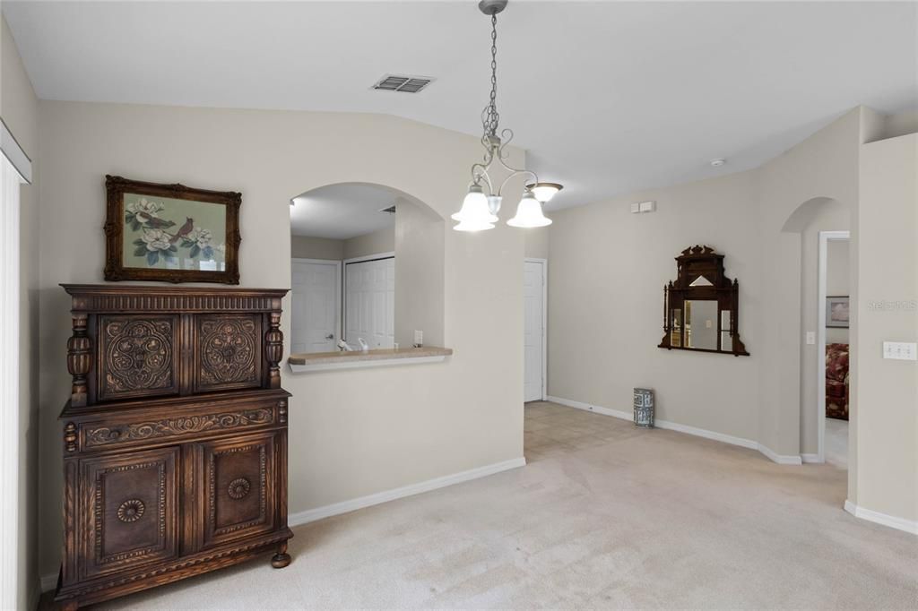 Formal Dining Room features a convenient arched pass thru