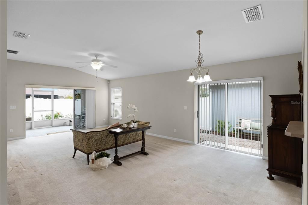 Living Room features triple glass sliding doors