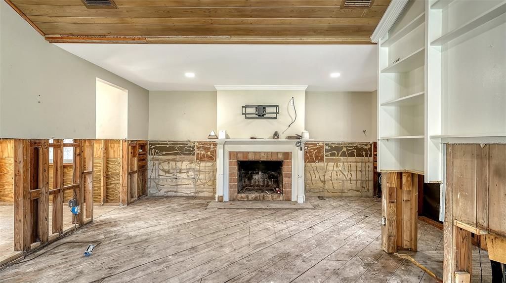 Living room with entrance to master bedroom