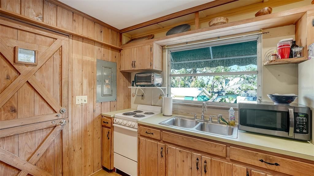 Guest bedroom above garage with lanai overlooking lagoon