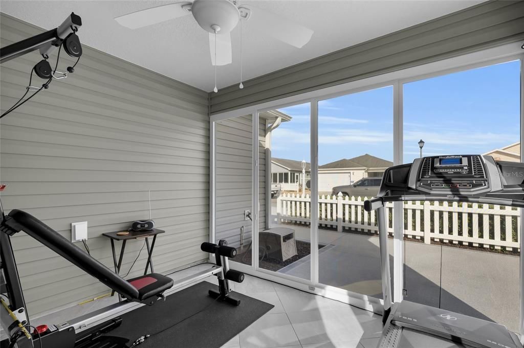 ENCLOSED LANAI WITH WORKOUT EQUIPMENT