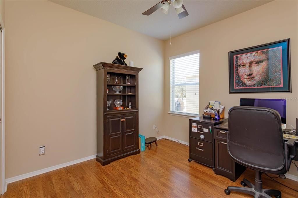 Bedroom 2 features laminate wood flooring