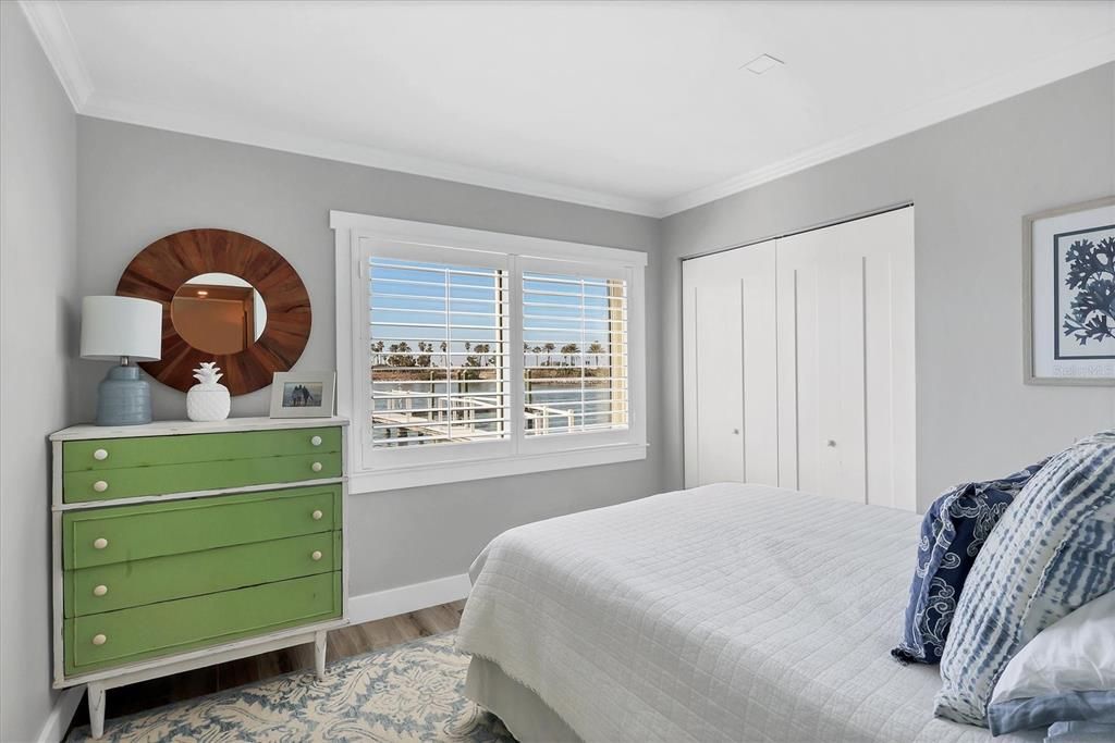 Guest suite with large closet and views of the bay