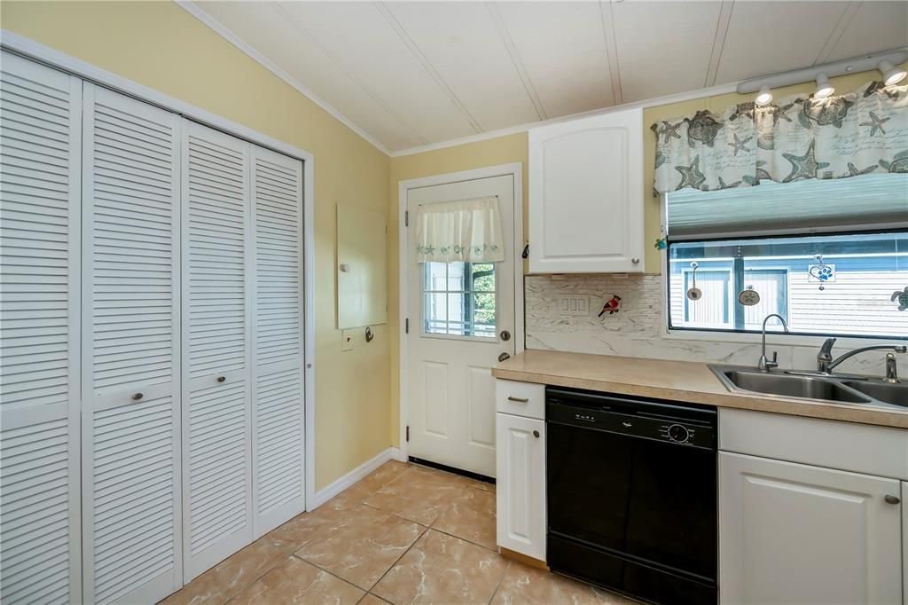 Kitchen showcasing large pantry