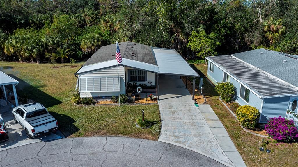 Front of home and greenspace in back