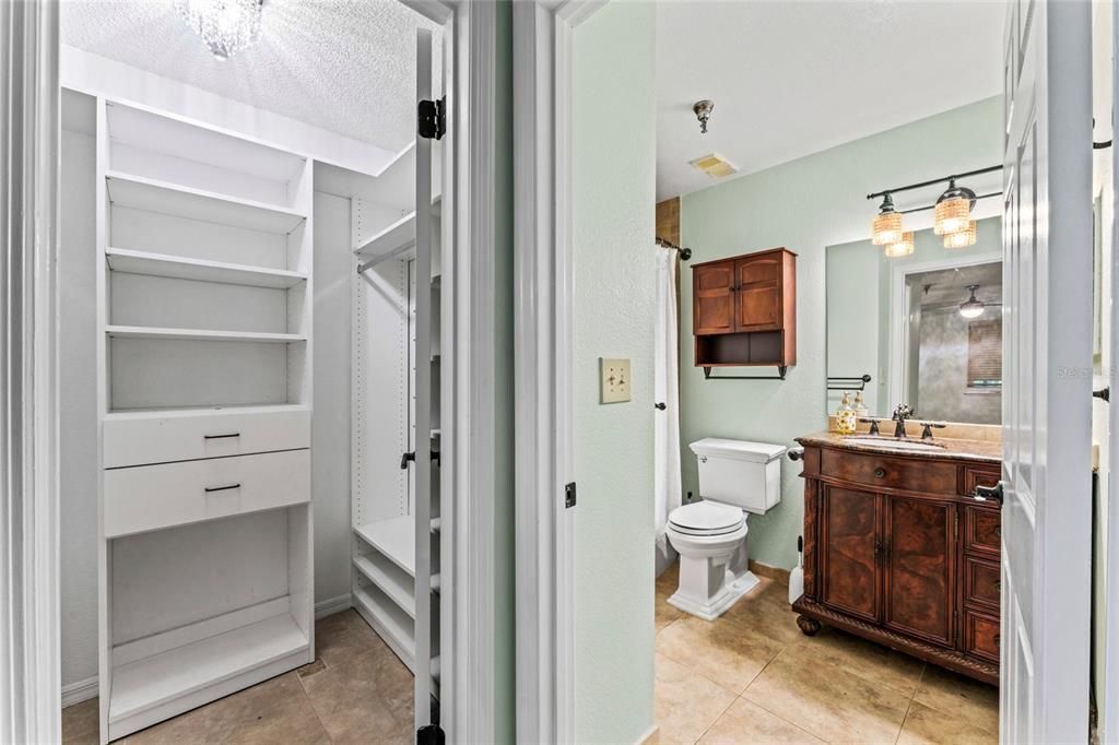 Walk-in closet in primary bedroom has built-in organizer. Both bathrooms offer soaking tubs.