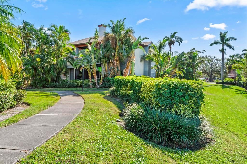 Corner home on the first floor with landscaping providing privacy.