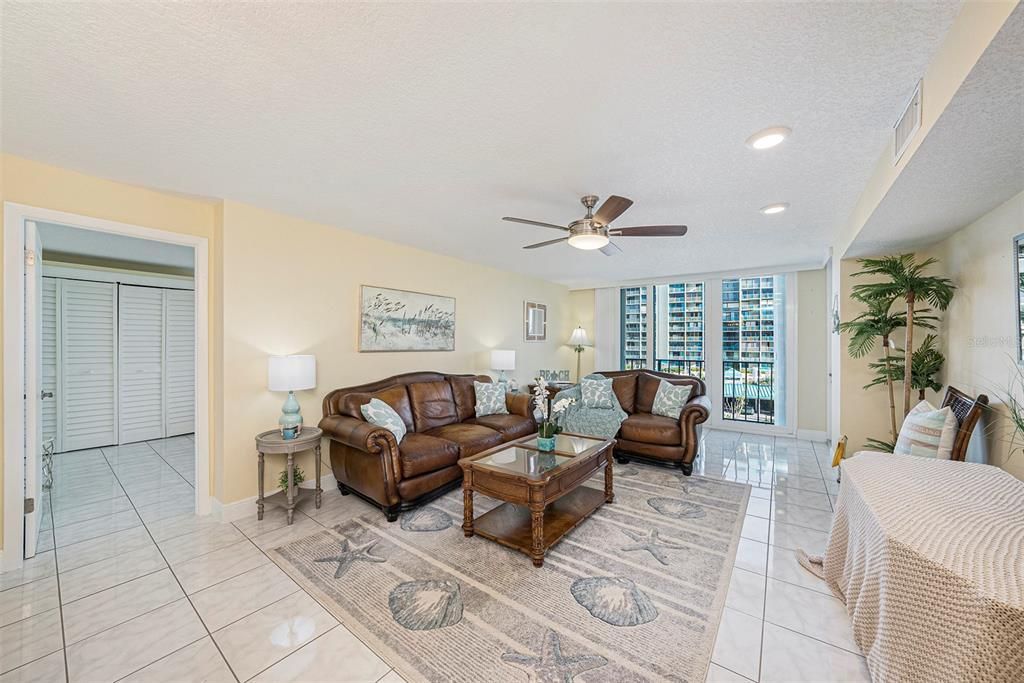 Living room with 3rd bedroom connecting to the living area. Convenient split floor plan. All Bedrooms have water views from Bed.