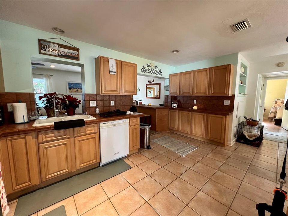 Kitchen with built in storage wall