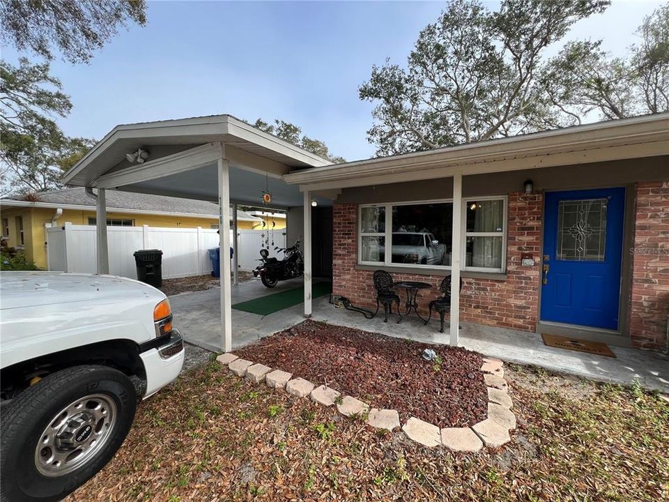 Front entry with carport and driveway parking