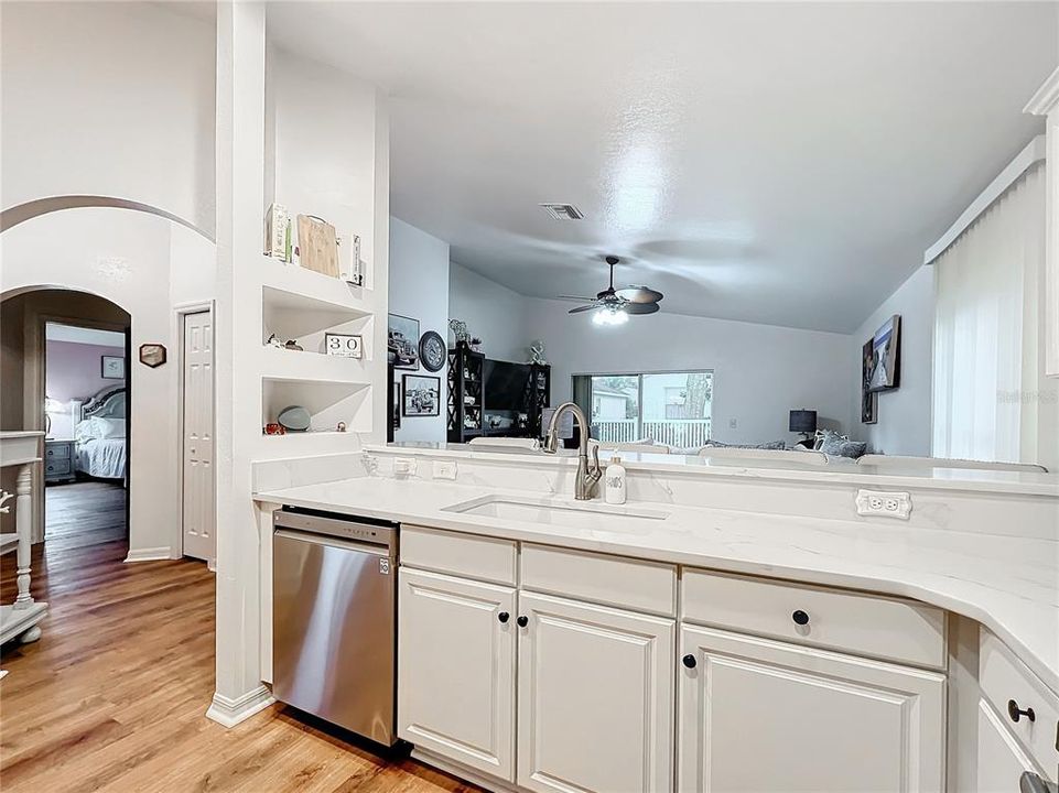 Kitchen has beautiful quartz countertops, new sink and faucet