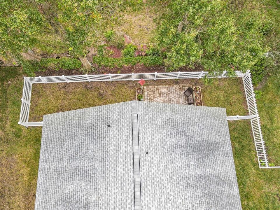 Aerial view of the fenced in backyard.