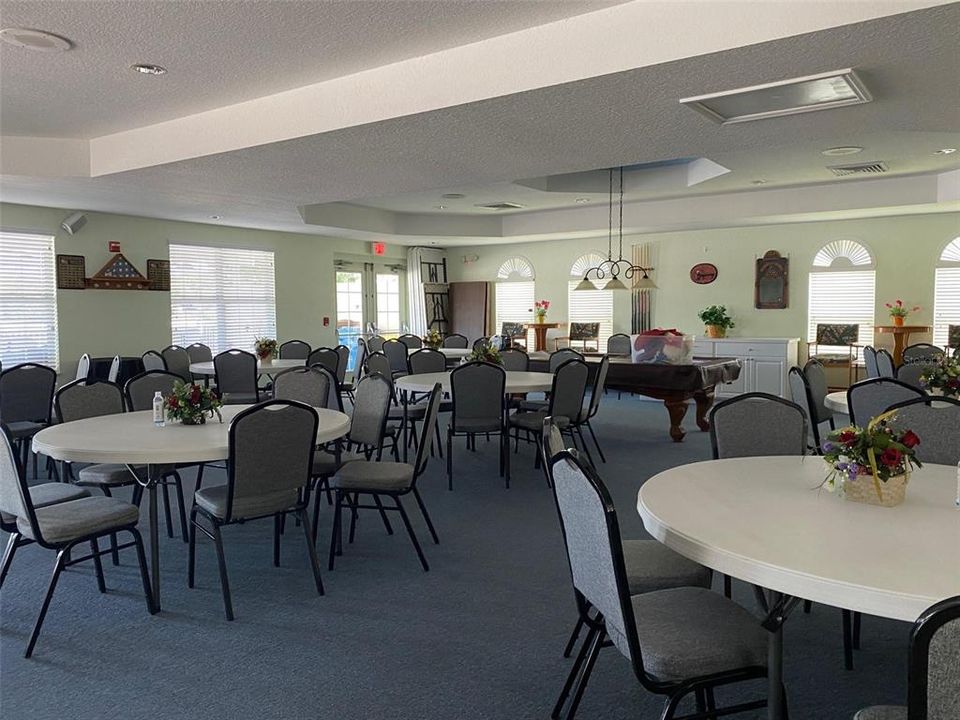 Inside the clubhouse there is plenty of room for community activities, plus there is a pool table.