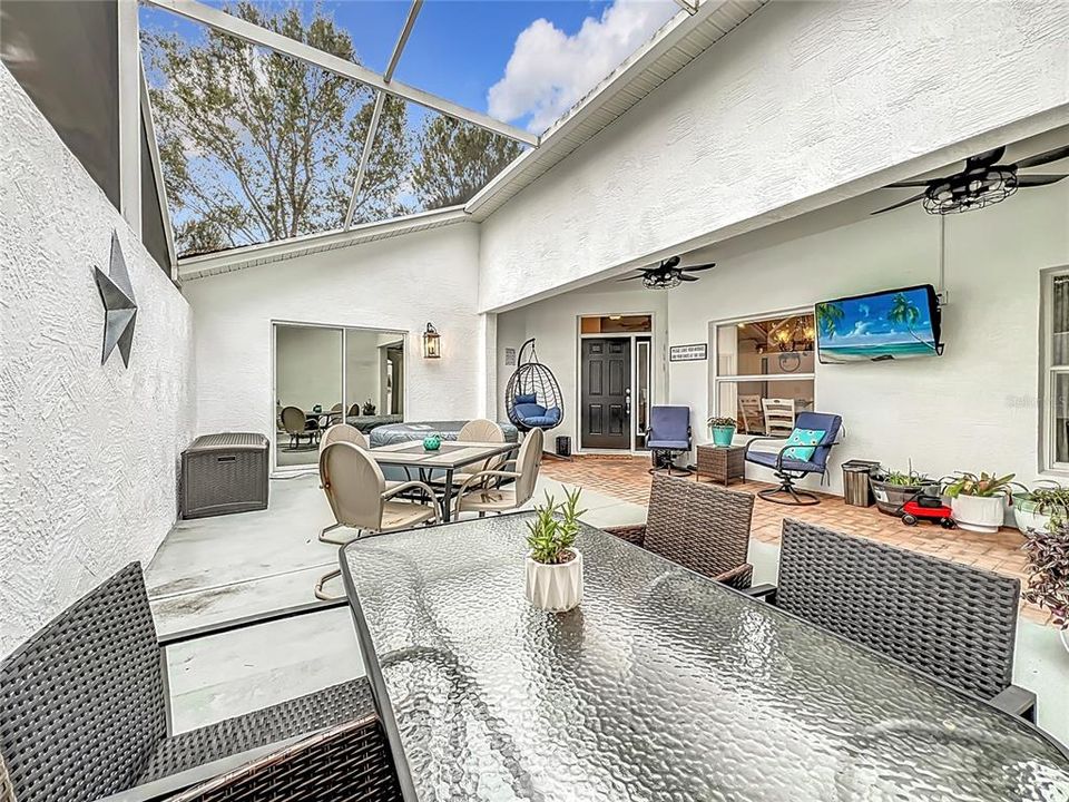 Looking towards the sliding glass doors of the primary bedroom - The courtyard offers an easy way to enjoy the privacy of the outdoors and provides lots of natural light into the home.