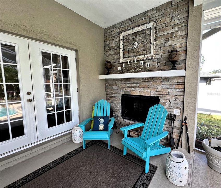 Outdoor Wood Burning Fireplace off of Primary Bedroom