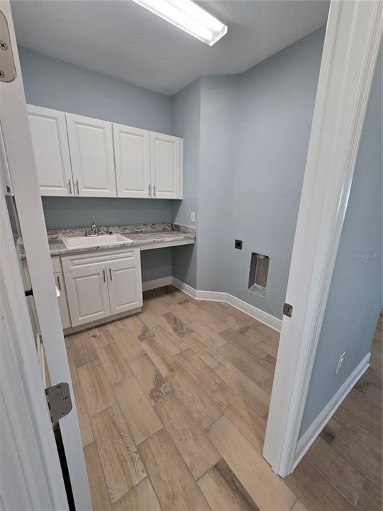 Laundry with sink and great storage