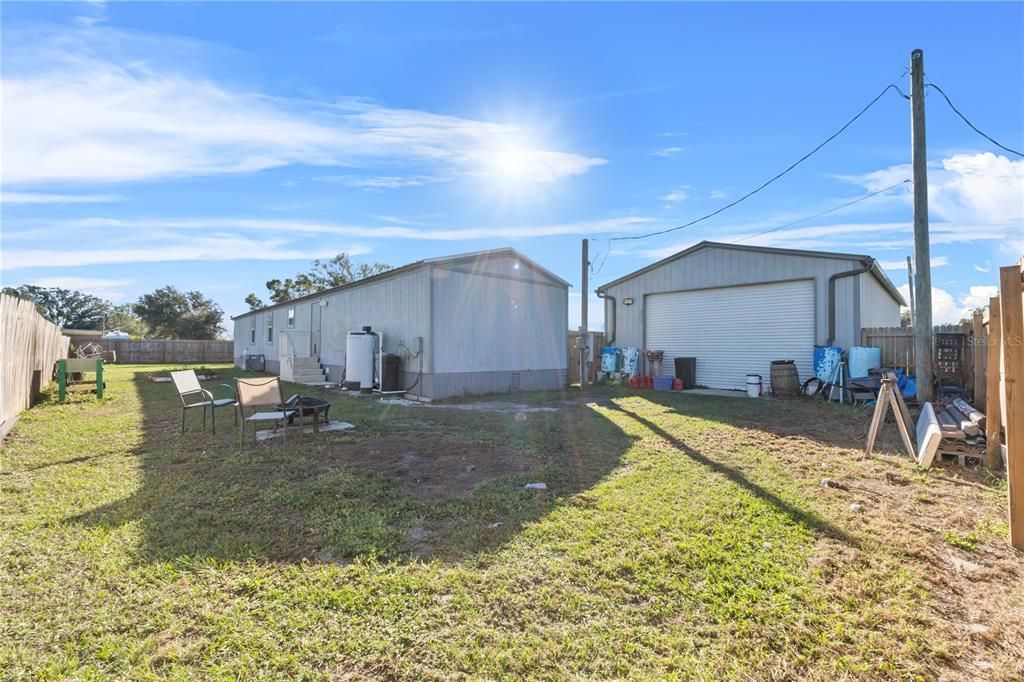 Back of the house with wooden fence