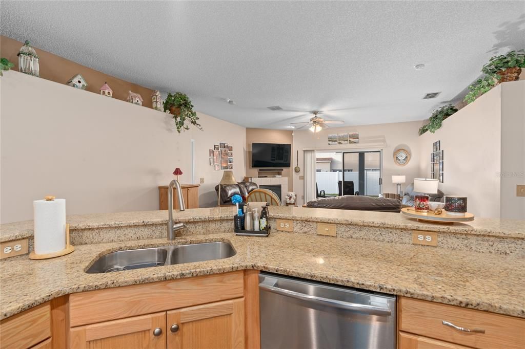 VIEW OF FAMILY ROOM FROM KITCHEN