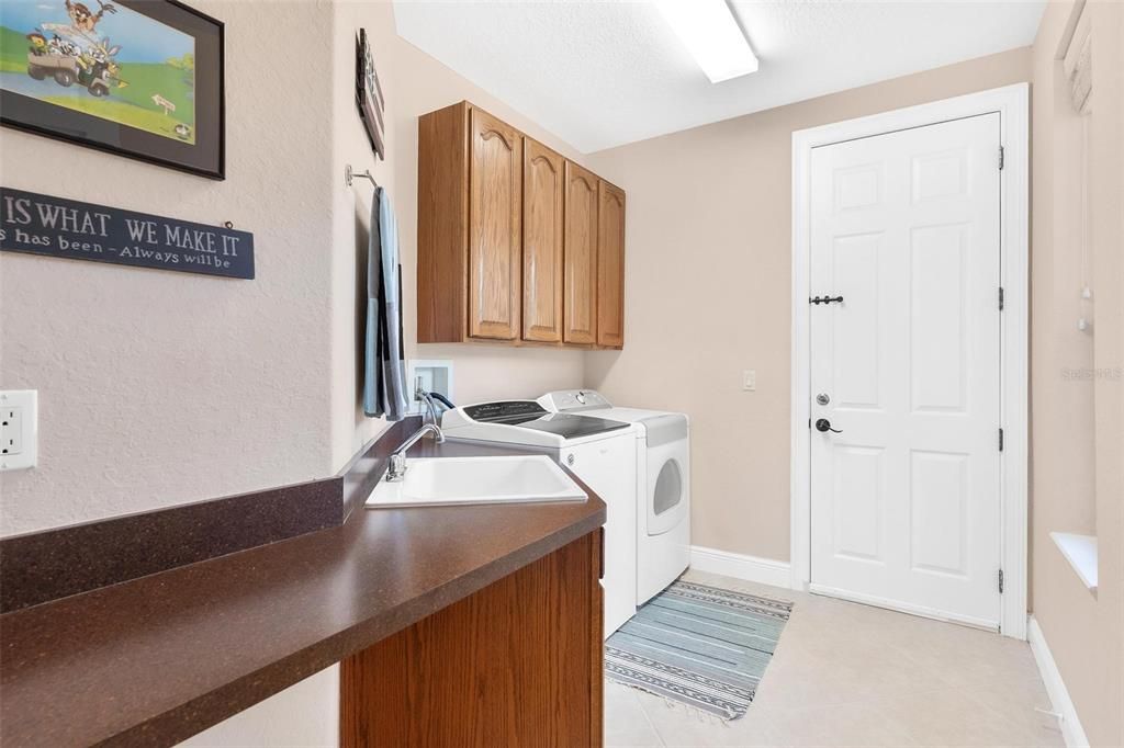 Inside laundry room with custom cabinets & folding area...