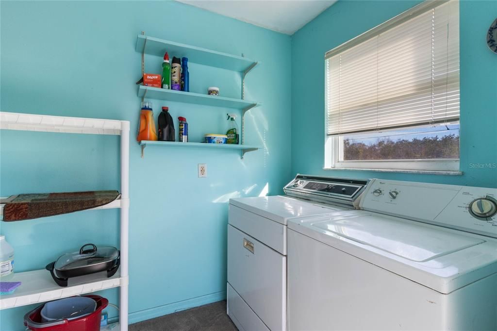 Laundry Room includes washer, dryer and mini refrigerator