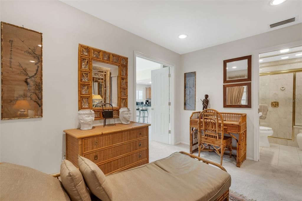 primary bedroom with walk-in closet and bathroom with steam shower