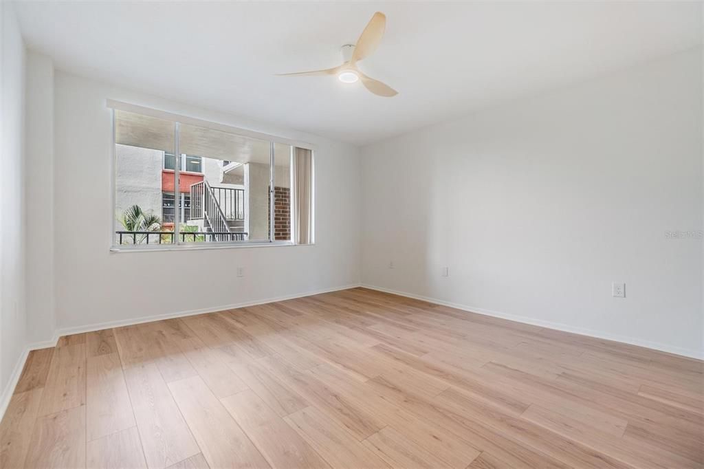 Second Bedroom features a walk-in cedar closet, private door to guest bathroom, and luxury vinyl floors.