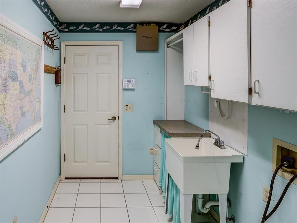 Inside laundry leading out to the garage.