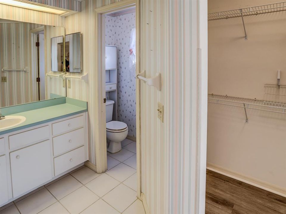 Master Bath with dual closets. .