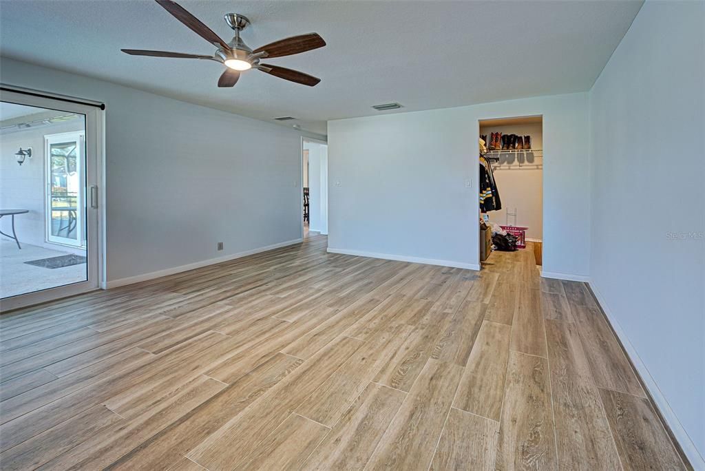 This bedroom has a large walk in closet.