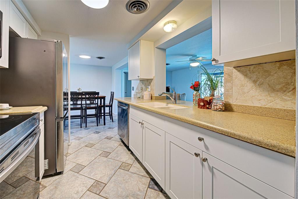 Bright and airy kitchen with a pass through to the Florida room.