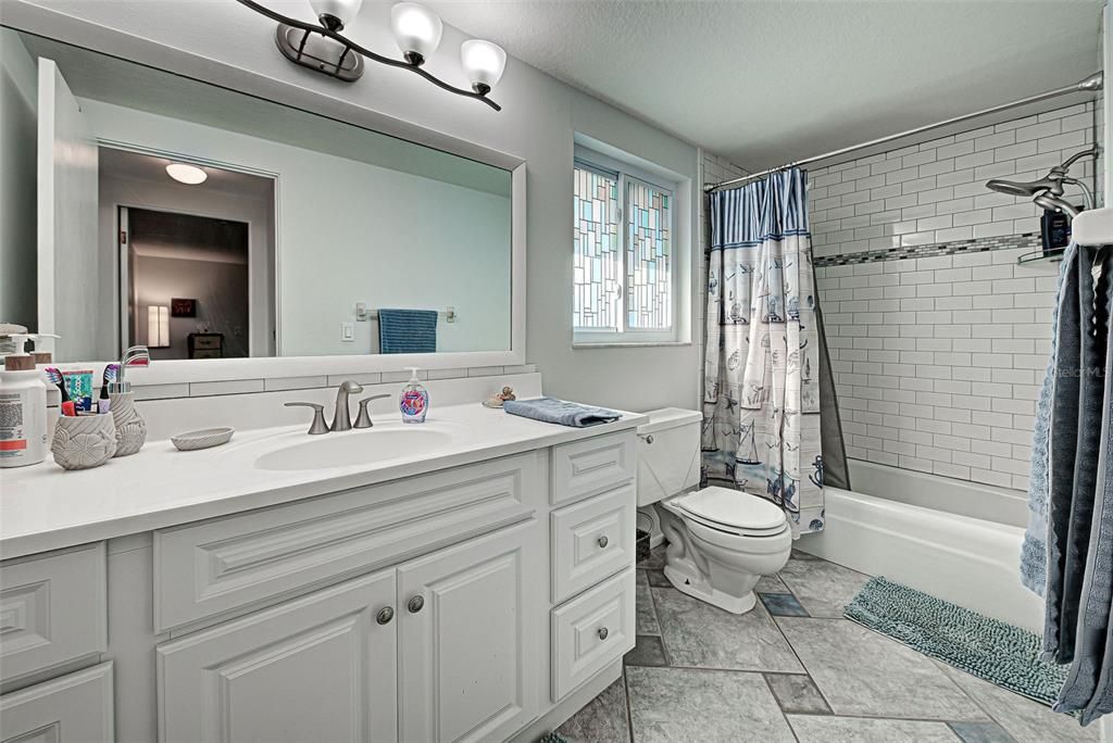 Beautiful bathroom with a tub and shower combination.