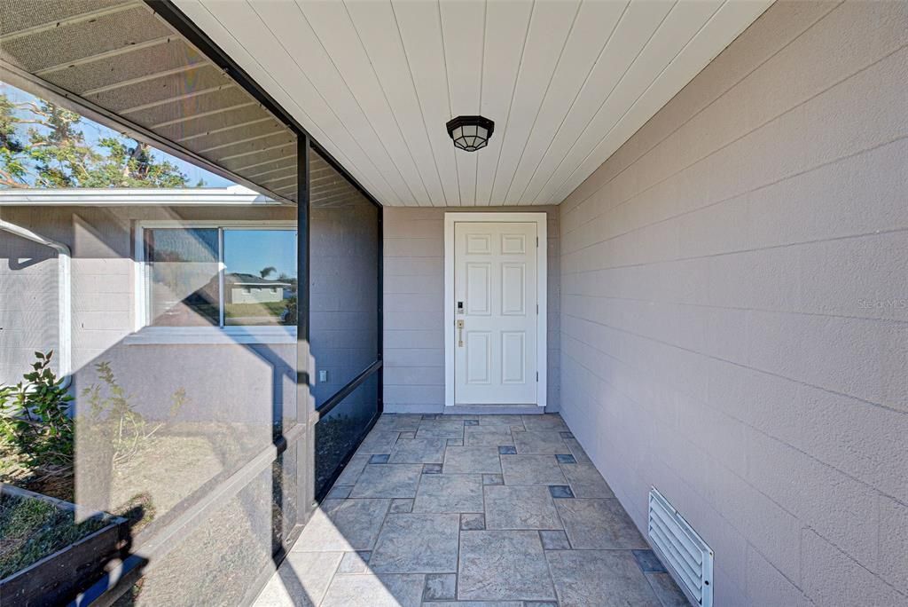 Tiled floor in the front porch.