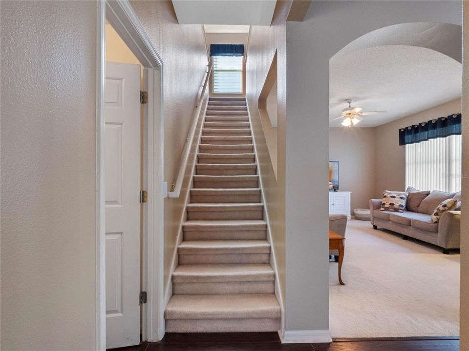 Stairs to the second story are tucked behind the family room