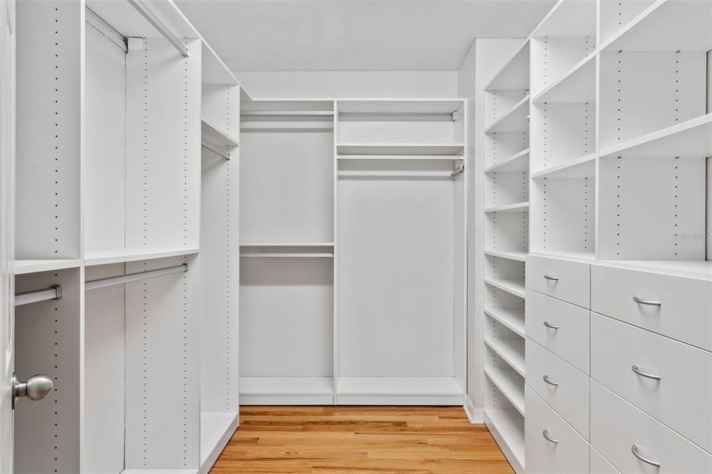 primary bedroom walk-in closets (2 of them) have closet systems