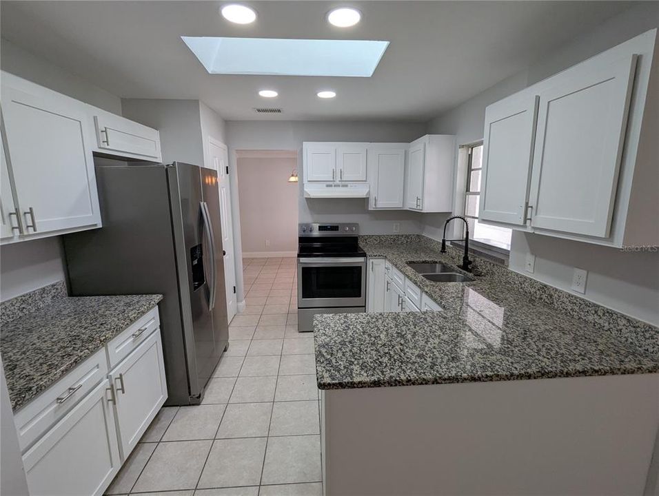 Kitchen with Granite Countertops and Stainless Steel appliances