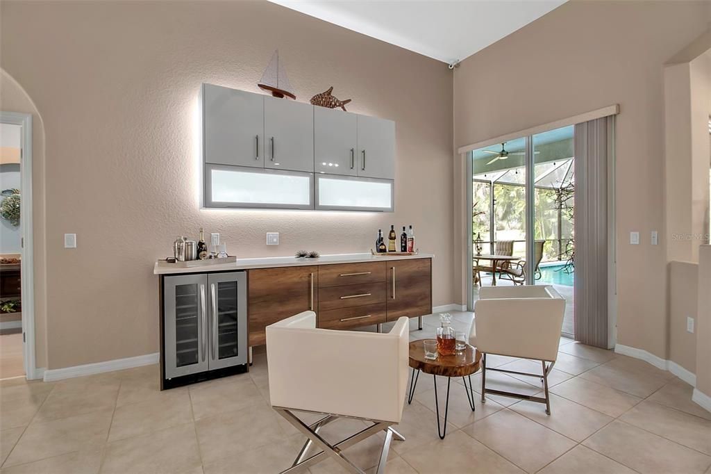 Cafe and Bar area complete with wine refrigerator and lighted custom cabinetry