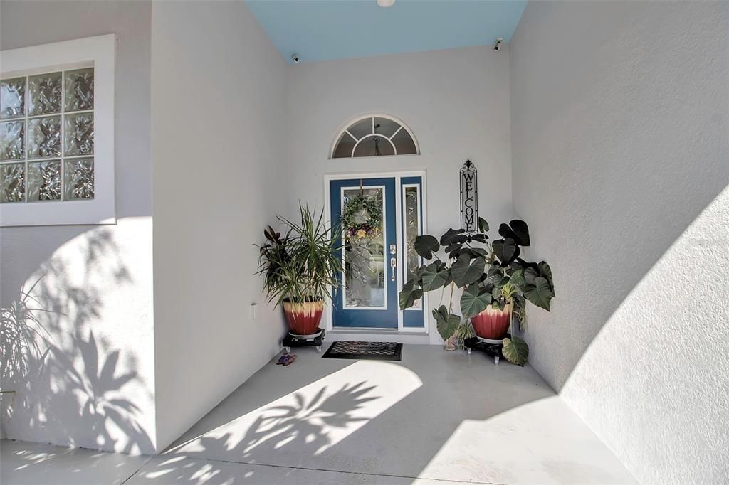 Big covered entry and front porch (notice the blue ceiling)