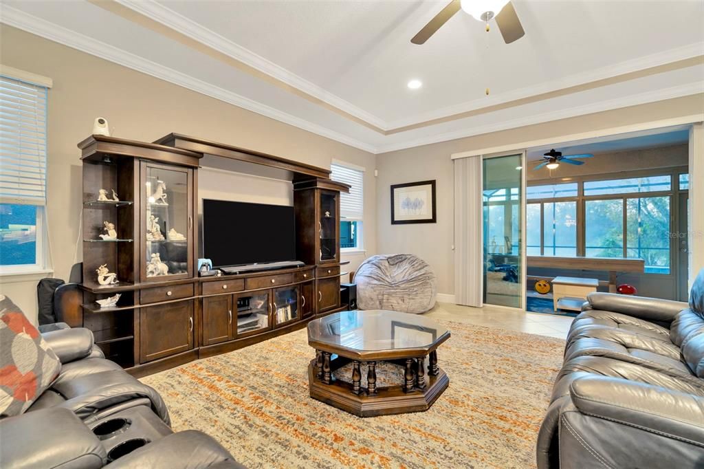 Great Room with Tray Ceiling overlooking Lanai & Pool