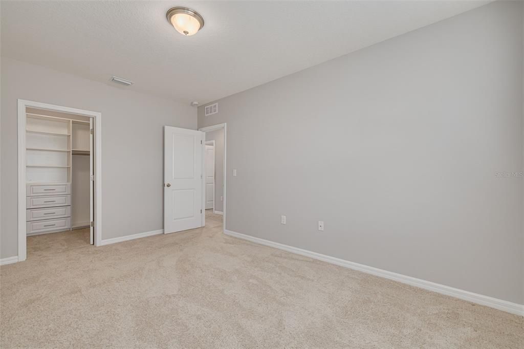 Guest Bedroom 3 with Custom Shelving in Closet