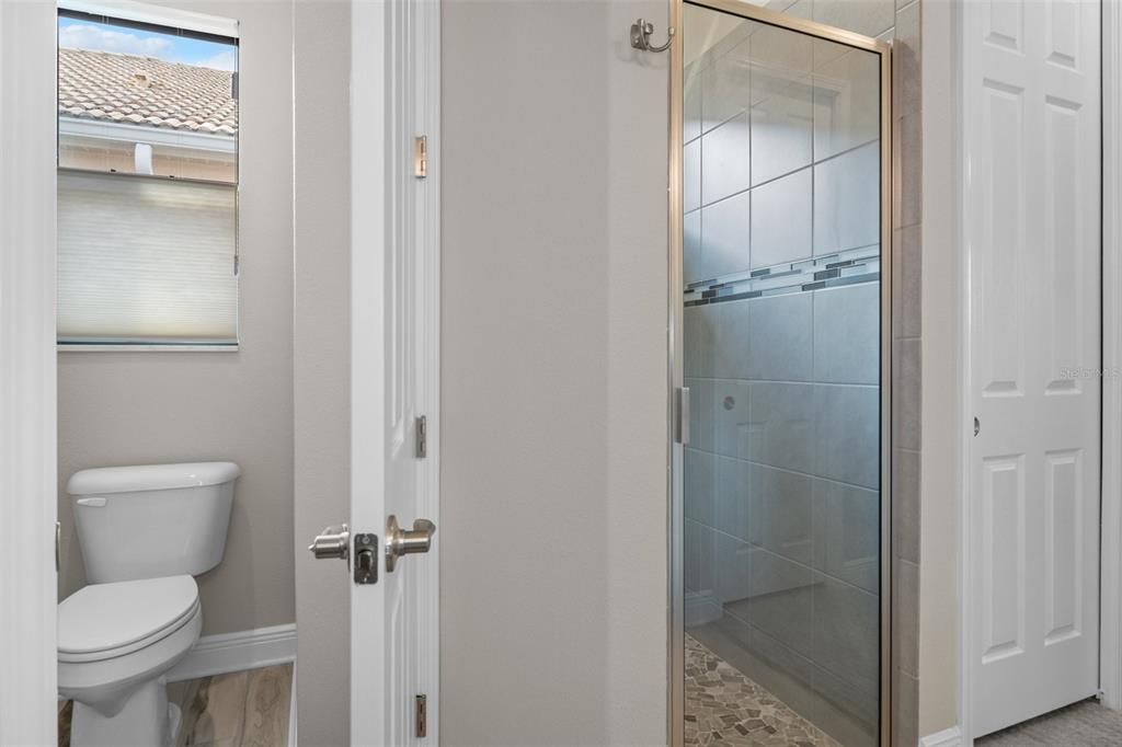 The WC also features a silhouette blind providing privacy and light. You'll appreciate the large easy walk-in shower.