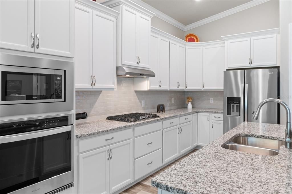 You'll appreciate the energy efficient features of the home, including natural gas cooktop, energy star appliances, exterior exhaust hood, and great storage.