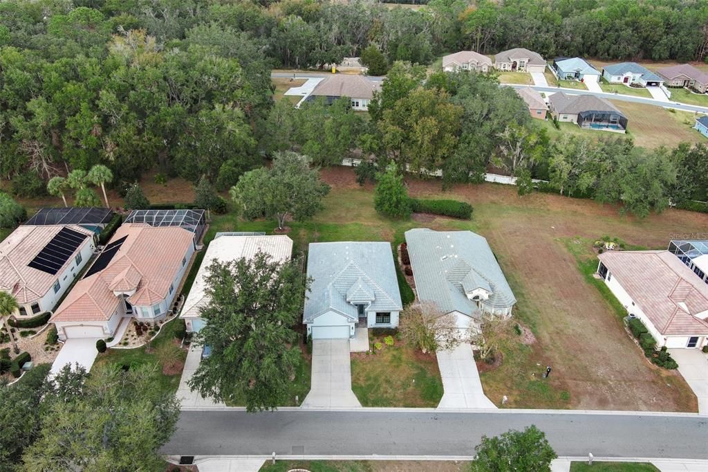 This home is in the center of the picture. Second on left from the vacant lot.